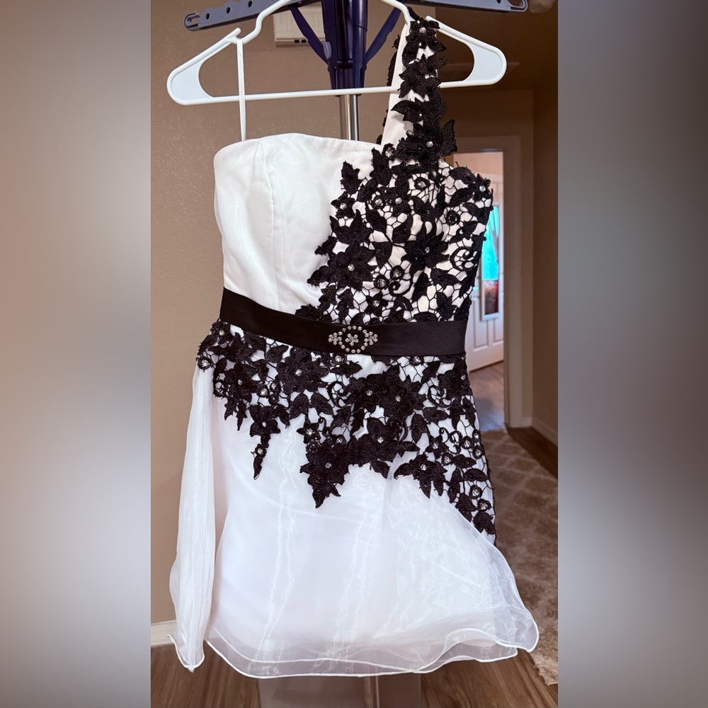 Elegant White Dress with Black Lace Detail